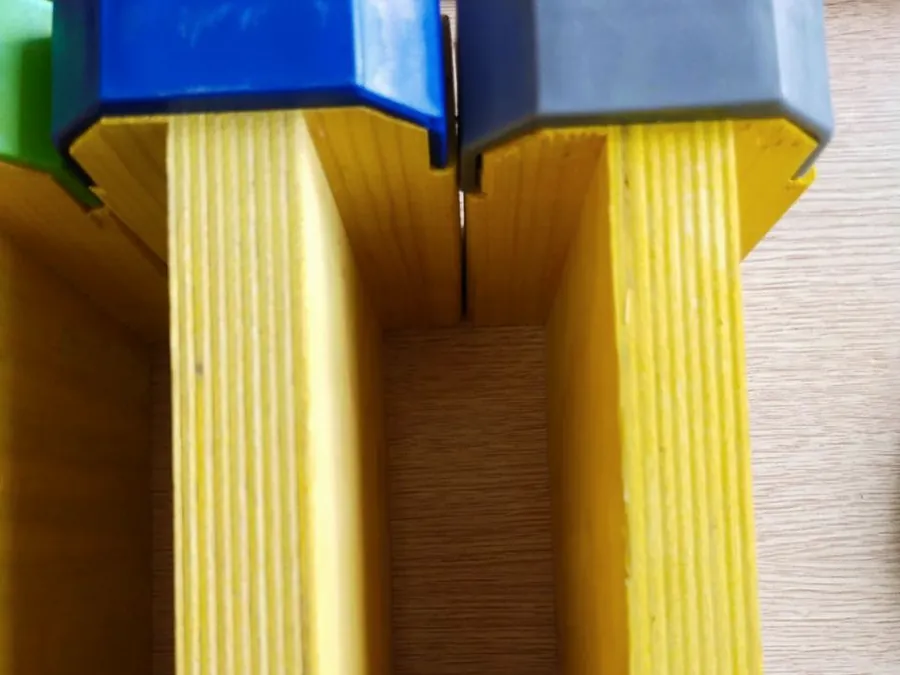 Two girder ends side by side with plastic end caps fitted